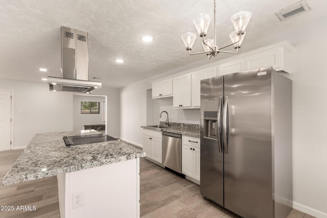1028 W 5th St, Mesa, AZ 85201 - kitchen with stainless steel appliances, island exhaust hood, a kitchen island, a sink, and white cabinetry