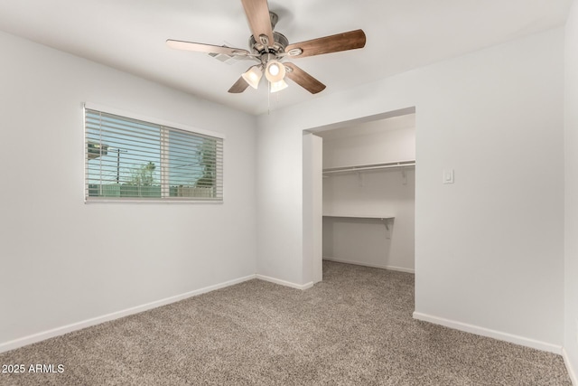 1028 W 5th St, Mesa, AZ 85201 - unfurnished bedroom with carpet flooring, a walk in closet, baseboards, and a closet