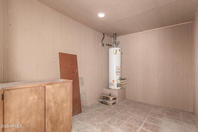 1028 W 5th St, Mesa, AZ 85201 - basement featuring gas water heater, wood walls, and wooden ceiling