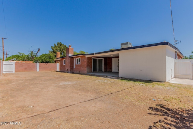 1028 W 5th St, Mesa, AZ 85201 - rear view of property with a chimney, brick siding, and a patio