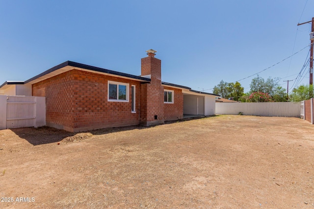 1028 W 5th St, Mesa, AZ 85201 - back of property featuring a chimney and brick siding
