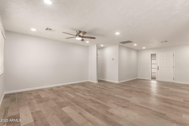 1028 W 5th St, Mesa, AZ 85201 - spare room with a ceiling fan, light wood finished floors, recessed lighting, baseboards, and a textured ceiling