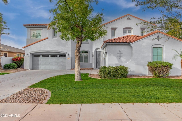 mediterranean / spanish-style house with a front yard and a garage