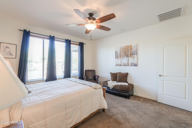 bedroom featuring baseboards, visible vents, ceiling fan, and carpet floors