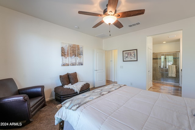 carpeted bedroom featuring ensuite bathroom and ceiling fan