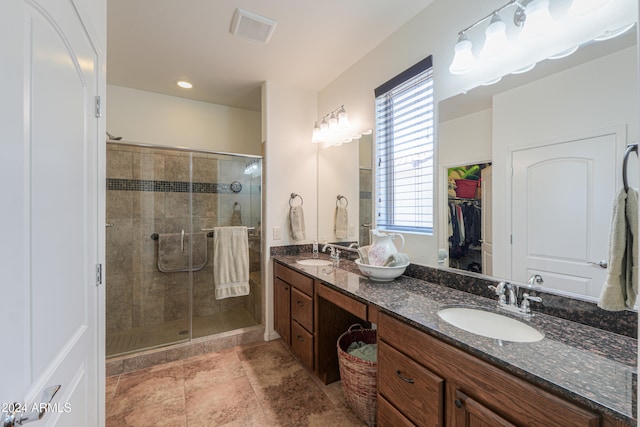 bathroom with vanity and walk in shower