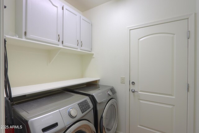 laundry room with cabinet space and independent washer and dryer