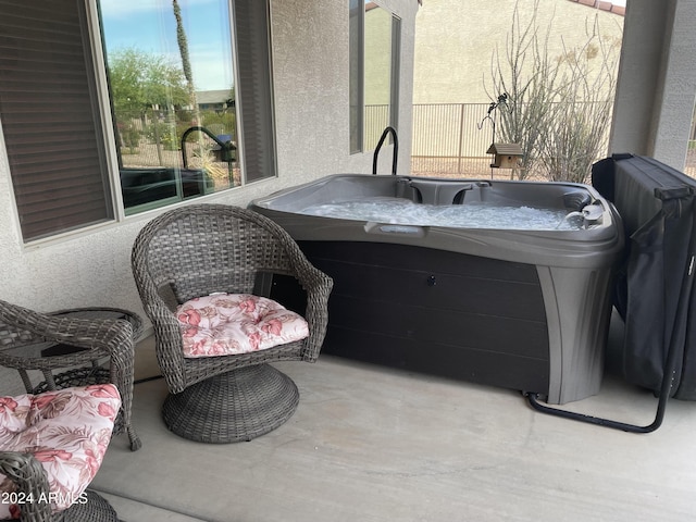 view of patio / terrace featuring a hot tub
