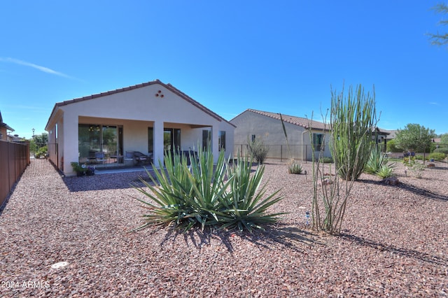 back of house with a patio area