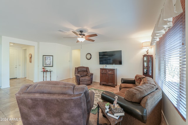 tiled living room featuring ceiling fan