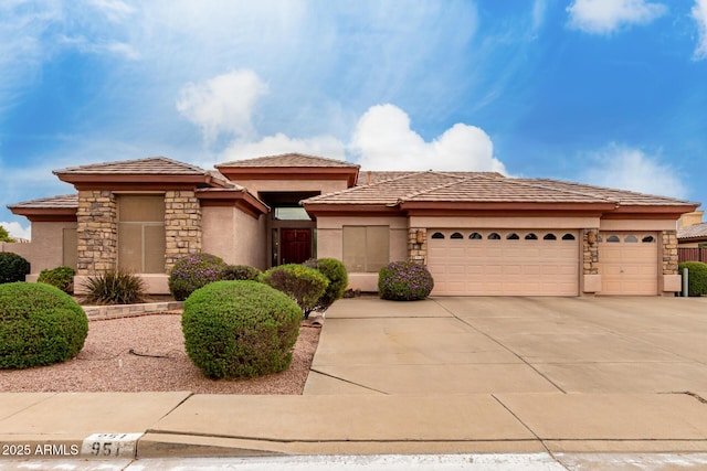 prairie-style house featuring stone siding, driveway, stucco siding, and an attached garage