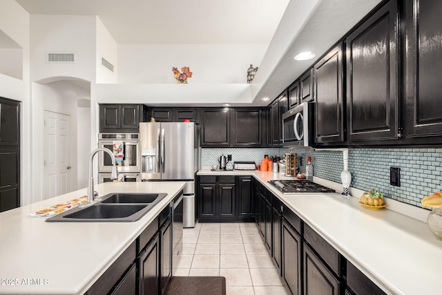 kitchen featuring visible vents, light countertops, a sink, and appliances with stainless steel finishes