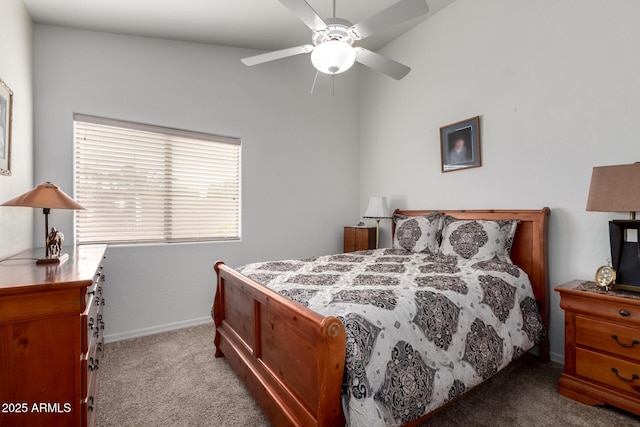 bedroom featuring baseboards, a ceiling fan, and light colored carpet