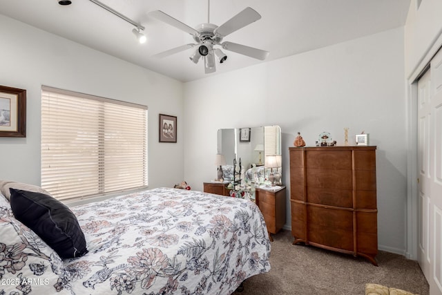 bedroom with a ceiling fan, carpet, and a closet