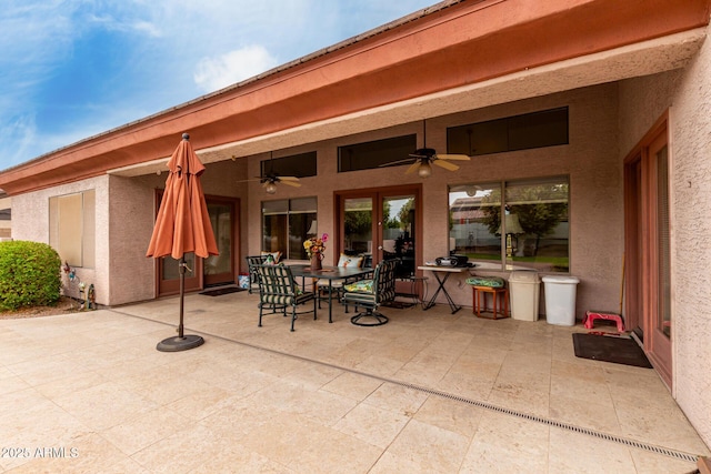 view of patio / terrace with outdoor dining space and ceiling fan