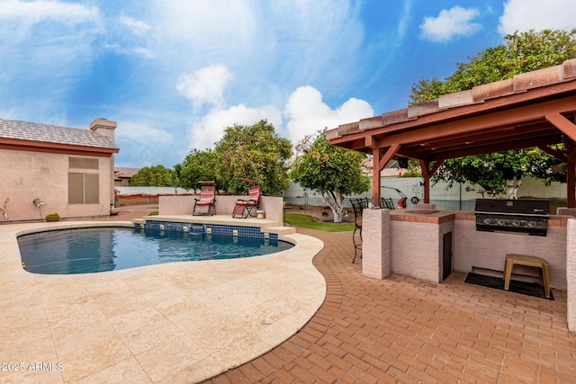 pool with a patio area, a grill, a fenced backyard, exterior kitchen, and outdoor dry bar