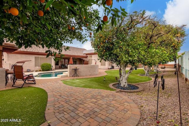 exterior space with fence and a patio