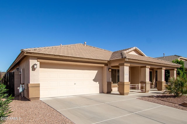 view of front facade featuring a garage and covered porch