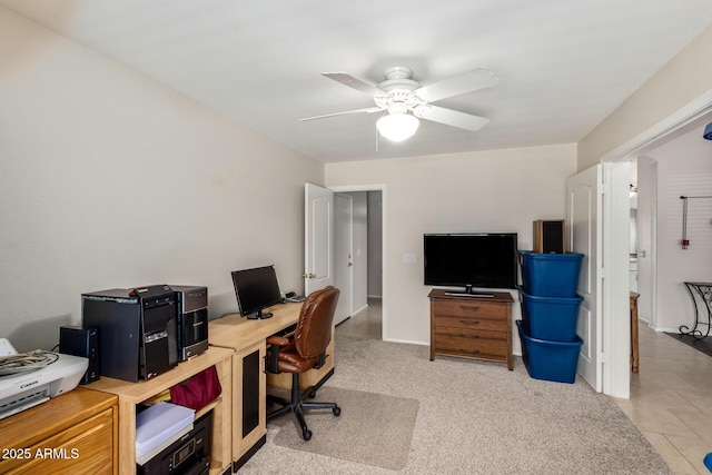 carpeted home office with ceiling fan