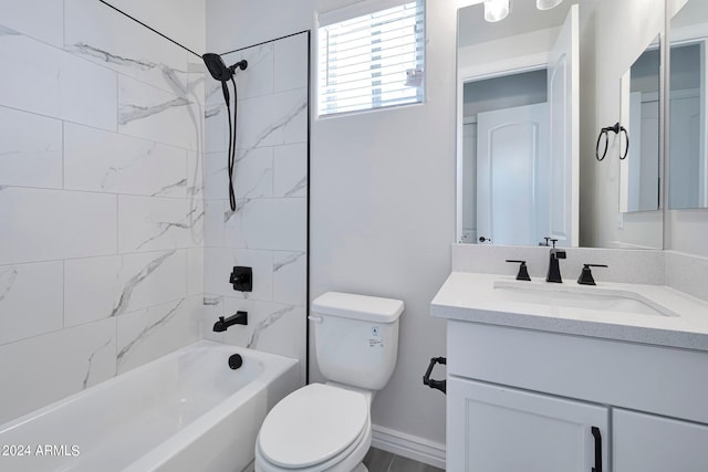 full bathroom featuring vanity, toilet, and tiled shower / bath combo