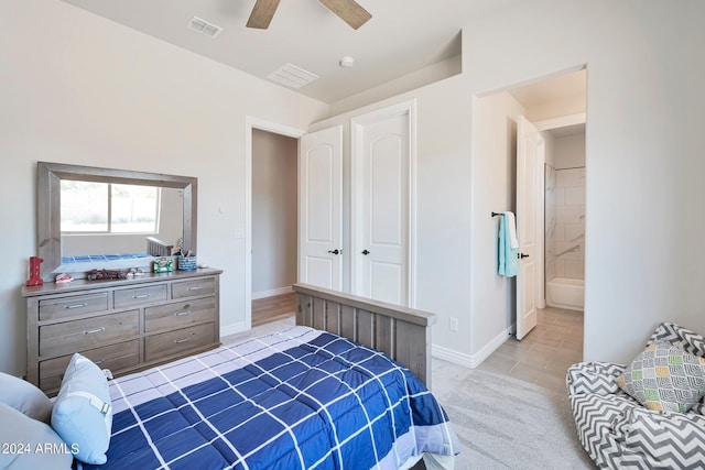 bedroom with ceiling fan and ensuite bath