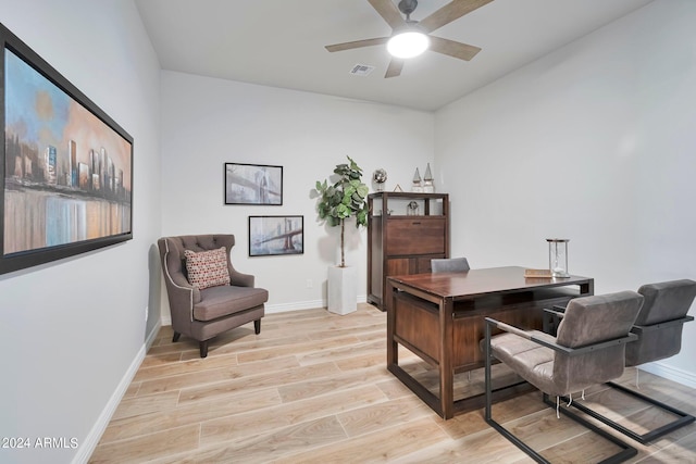 office space with light hardwood / wood-style flooring and ceiling fan