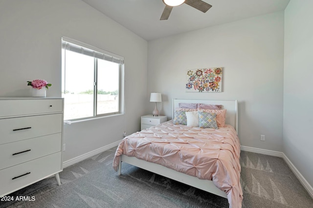 bedroom with ceiling fan and dark carpet