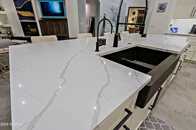 kitchen with light stone countertops and a kitchen island