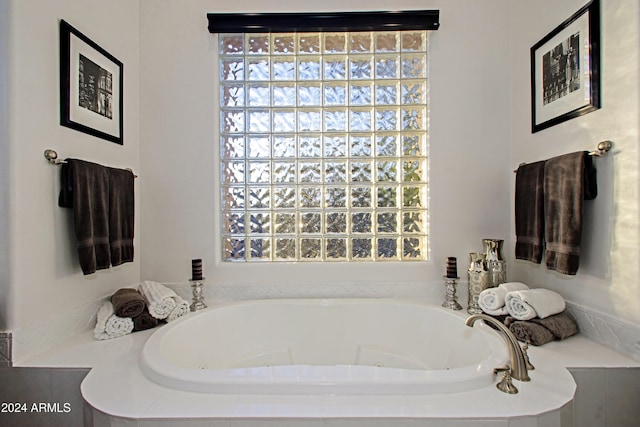 bathroom featuring tiled bath