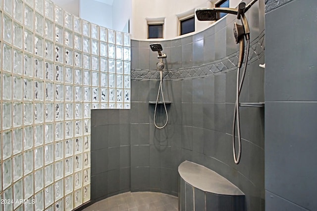 bathroom featuring a tile shower