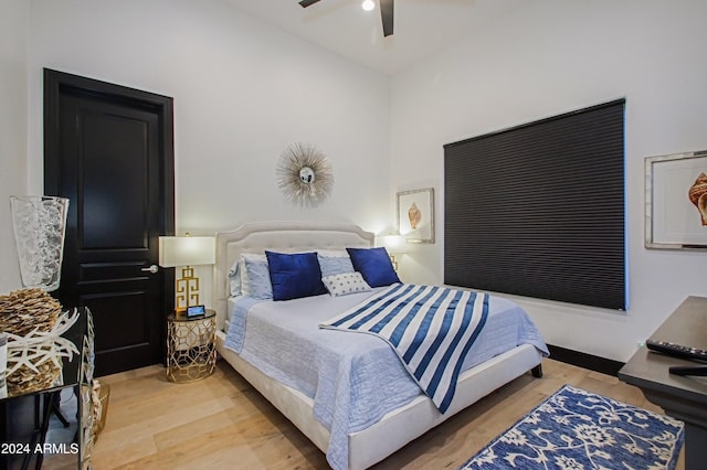 bedroom with ceiling fan and wood-type flooring