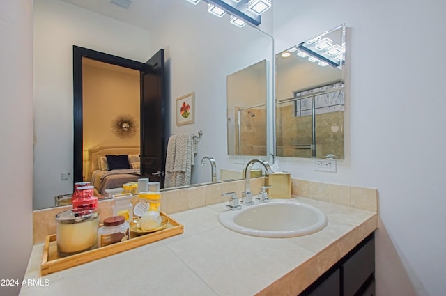 bathroom with vanity and an enclosed shower