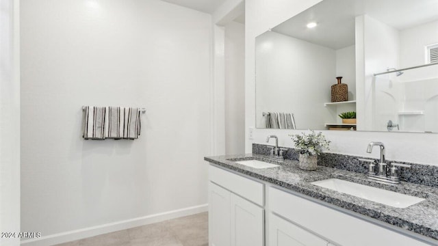 38100 W Bello Ln, Maricopa, AZ 85138 - full bath featuring baseboards, double vanity, and recessed lighting