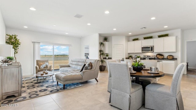 38100 W Bello Ln, Maricopa, AZ 85138 - dining space with recessed lighting and light tile patterned floors