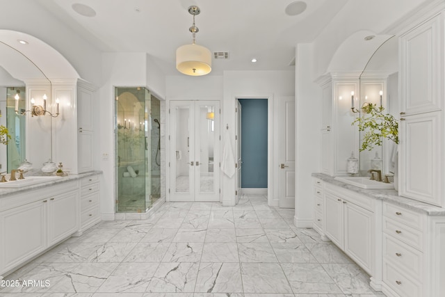 37334 N Winding Wash Trl, Carefree, AZ 85377 - full bath featuring a sink, two vanities, a stall shower, and marble finish floor