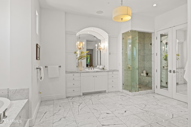 37334 N Winding Wash Trl, Carefree, AZ 85377 - full bath featuring vanity, marble finish floor, recessed lighting, baseboards, and a shower stall