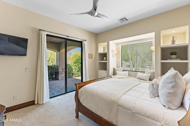 37334 N Winding Wash Trl, Carefree, AZ 85377 - carpeted bedroom with baseboards, access to outside, multiple windows, and visible vents