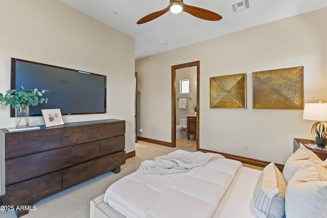 37334 N Winding Wash Trl, Carefree, AZ 85377 - carpeted bedroom with ceiling fan, baseboards, visible vents, and ensuite bathroom