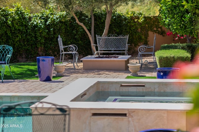 37334 N Winding Wash Trl, Carefree, AZ 85377 - view of patio / terrace featuring a swimming pool and a fire pit