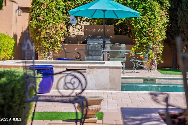 37334 N Winding Wash Trl, Carefree, AZ 85377 - view of pool featuring exterior kitchen, a bar, and a patio area