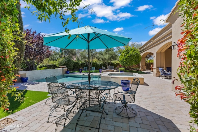 37334 N Winding Wash Trl, Carefree, AZ 85377 - view of patio / terrace with a hot tub and an outdoor pool