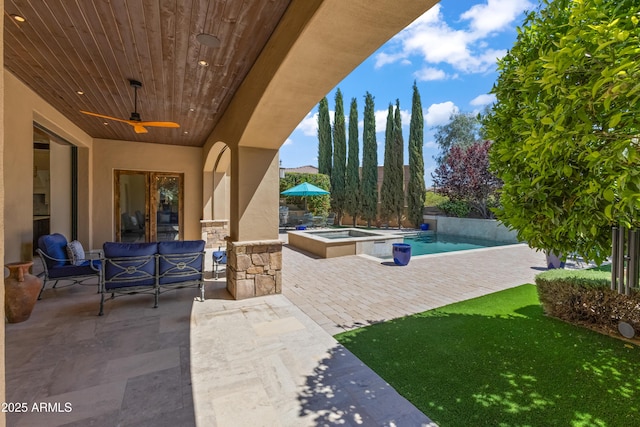37334 N Winding Wash Trl, Carefree, AZ 85377 - view of patio featuring an in ground hot tub, ceiling fan, an outdoor living space, and an outdoor pool