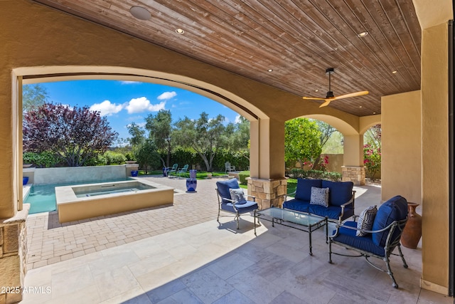 37334 N Winding Wash Trl, Carefree, AZ 85377 - view of patio / terrace featuring an outdoor hangout area, a ceiling fan, an in ground hot tub, and an outdoor pool