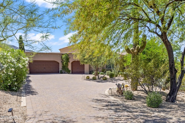 37334 N Winding Wash Trl, Carefree, AZ 85377 - view of front facade featuring an attached garage, decorative driveway, and stucco siding