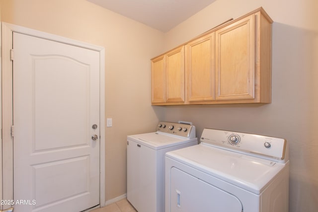 washroom with cabinet space and washer and dryer