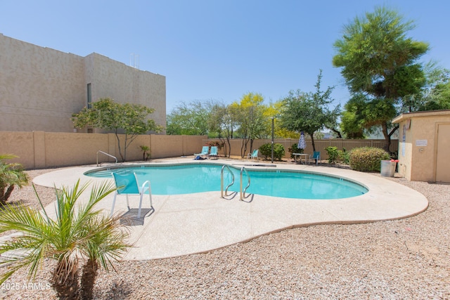 view of pool with a fenced in pool, a fenced backyard, and a patio area