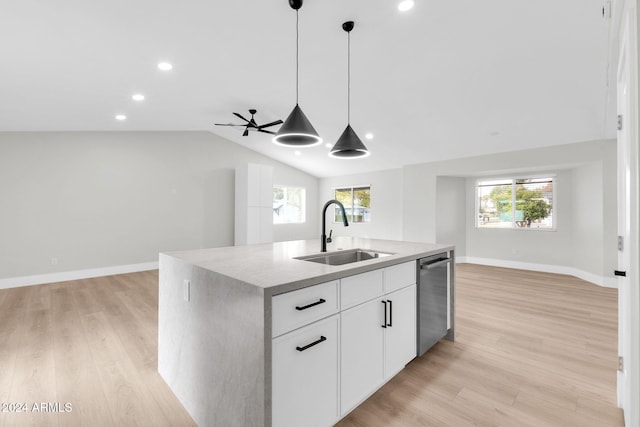 kitchen with dishwasher, sink, a healthy amount of sunlight, a center island with sink, and white cabinets