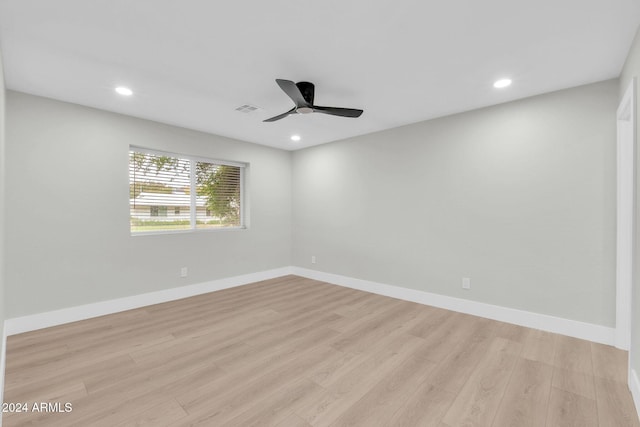 unfurnished room with ceiling fan and light hardwood / wood-style floors