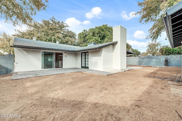 back of property featuring a patio area