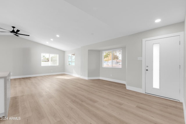 entrance foyer with light wood-type flooring, vaulted ceiling, and ceiling fan